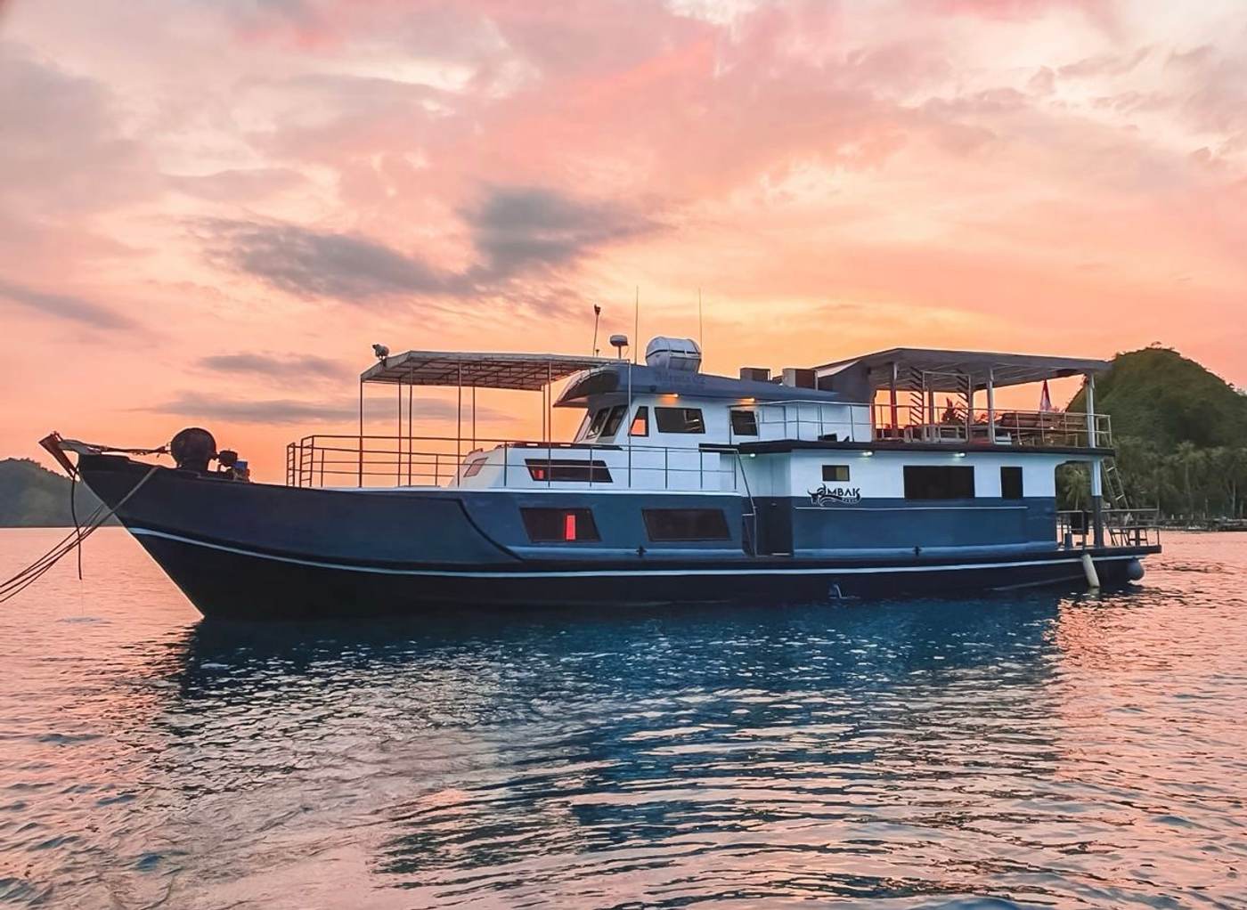 The Ombak Kabau surf charter boat at anchor at sunset in the Mentawai Islands